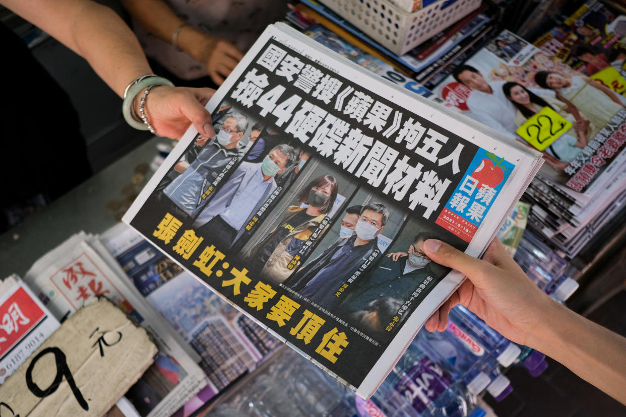 People bought an Apple Daily newspaper at the newsstand  in Hong Kong, China, on June 18, 2021. Apple Daily printed 500,000 copies of the pro-democracy paper. People in Hong Kong called for the purchase of Apple Daily as a sign of support. On Thursday, the Hong Kong police arrested five Apple Daily executives and top editors and blocked $18 million Hong Kong dollars in assets of media companies. (Photo by Leung Man Hei/NurPhoto via Getty Images)