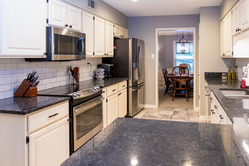 The kitchen features ample storage and food preparation areas.