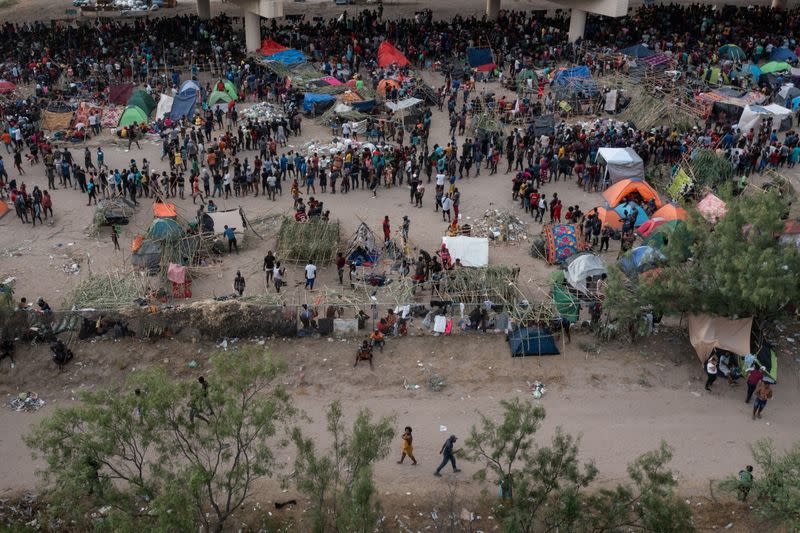 Migrants shelter near Del Rio International Bridge in Del Rio, Texas