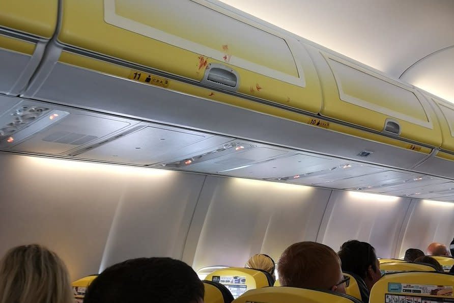 Ryanair fight: Blood splatters across plane cabin as two men brawl in row over 'woman not wearing shoes'