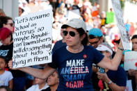 <p>Protesters hold signs at a gun control at the Broward County Federal Courthouse in Fort Lauderdale, Fla., on Feb. 17, 2018. (Photo: Rhona Wise/AFP/Getty Images) </p>