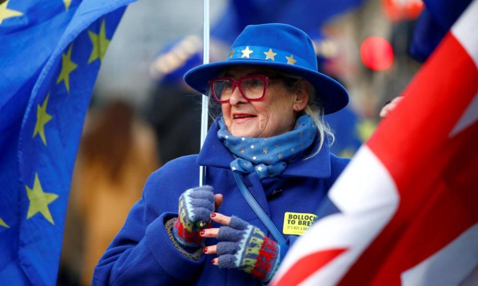 An anti-Brexit demonstrator protests outside the houses of parliament in London