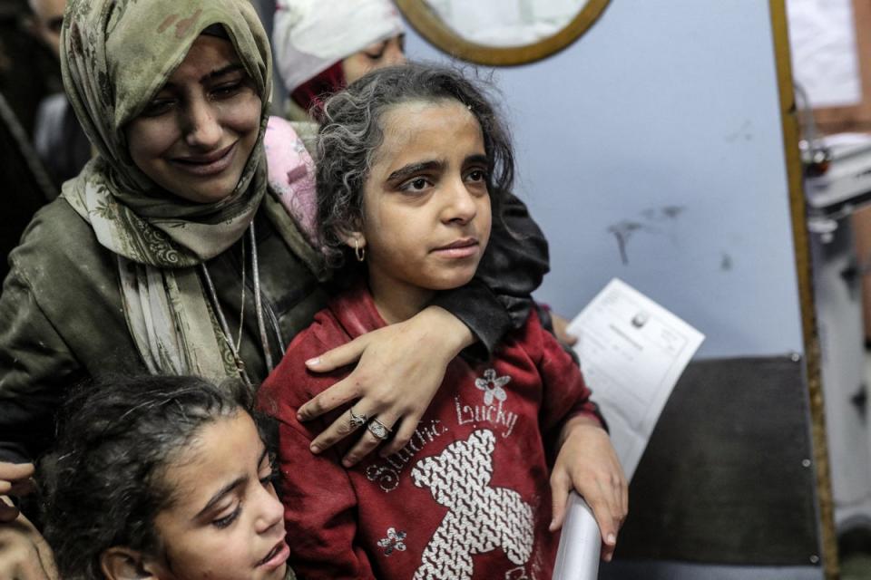 Palestinians, wounded in an Israeli strike, receive treatment at the Nasser hospital in Khan Younis (AFP)