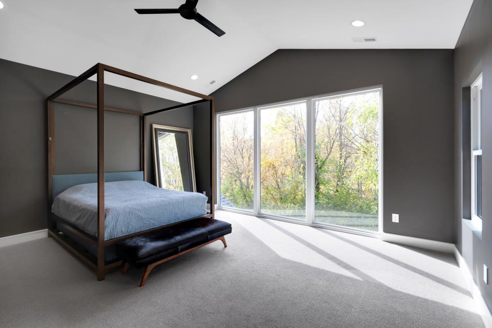 The primary bedroom is painted Urbane Bronze by Sherwin Williams inside this home in Louisville’s Rivers Edge subdivision.