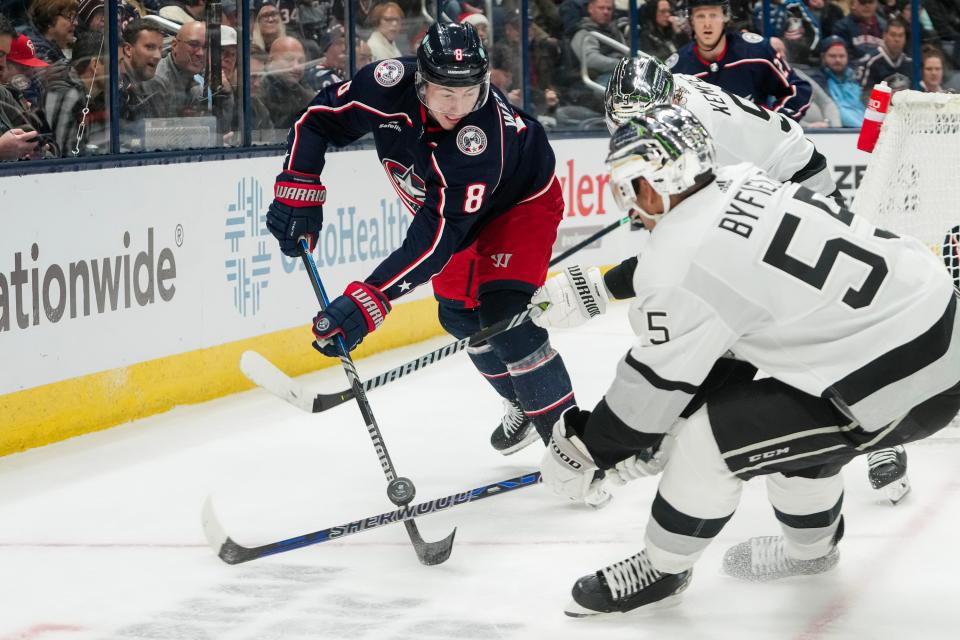 Dec 5, 2023; Columbus, Ohio, USA; Columbus Blue Jackets defenseman Zach Werenski (8) fights for the puck with Los Angeles Kings center Quinton Byfield (55) during the second period of the NHL game at Nationwide Arena.