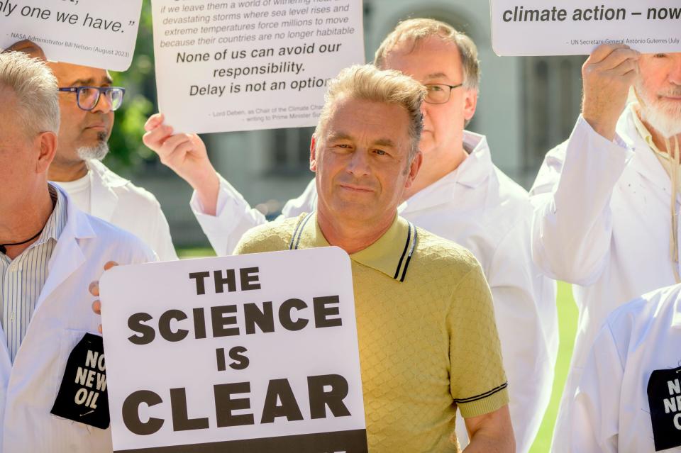 TV nature presenter Chris Packham with scientists in Parliament Square to protest against the granting of new licenses for oil extraction. London, UK.