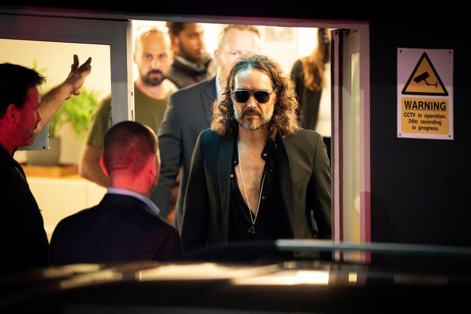 Russell Brand leaves the Troubabour Wembley Park theater in London after performing a comedy set on Sept. 16, 2023.