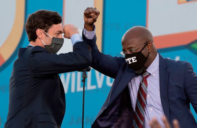 Victories in a pair of runoff elections in January made Jon Ossoff (left) the first Jewish U.S. senator ever elected in Georgia and the Rev. Raphael Warnock the first Black senator in the state's history. (Photo: JIM WATSON via Getty Images)