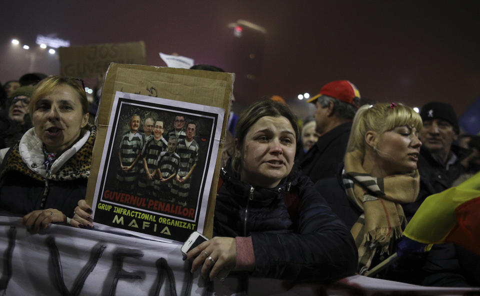 Protester cries during a demonstration in Bucharest