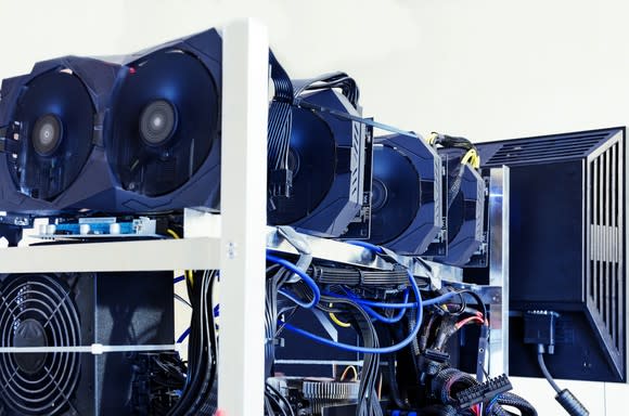 Multiple hard drives and graphics cards being used to mine digital currencies.