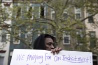A demonstrator holds a sign in front of the Baltimore Police Department Western District station to protest against the death in police custody of Freddie Gray in Baltimore April 23, 2015. The U.S. Southern Christian Leadership Conference will independently investigate the death of a black Baltimore man in police custody, with the local head of the civil rights group saying it lacked confidence in a police probe into the death. REUTERS/Sait Serkan Gurbuz