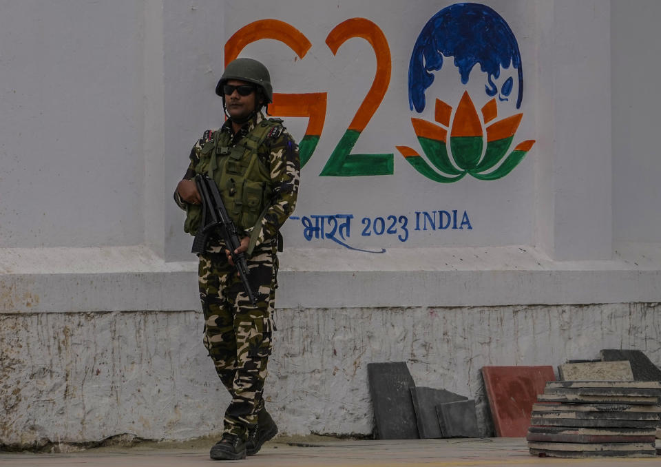 An Indian paramilitary soldier stands guard in Srinagar, Indian controlled Kashmir, Tuesday, May 16, 2023. Indian authorities have stepped up security and deployed elite commandos to prevent rebel attacks during a meeting of officials from the Group of 20 industrialized and developing nations in the disputed region next week. (AP Photo/Mukhtar Khan)