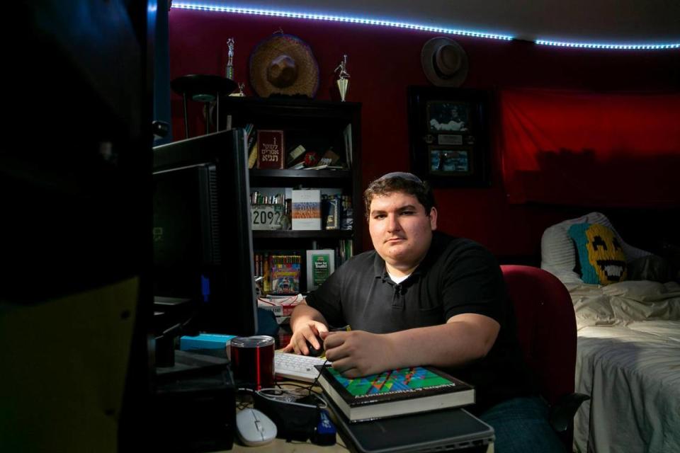 Salomon Assouline, 17, an 11th-grader at Dr. Michael M. Krop Senior High School, studies after school at his home in Miami on Monday, March 9, 2021.