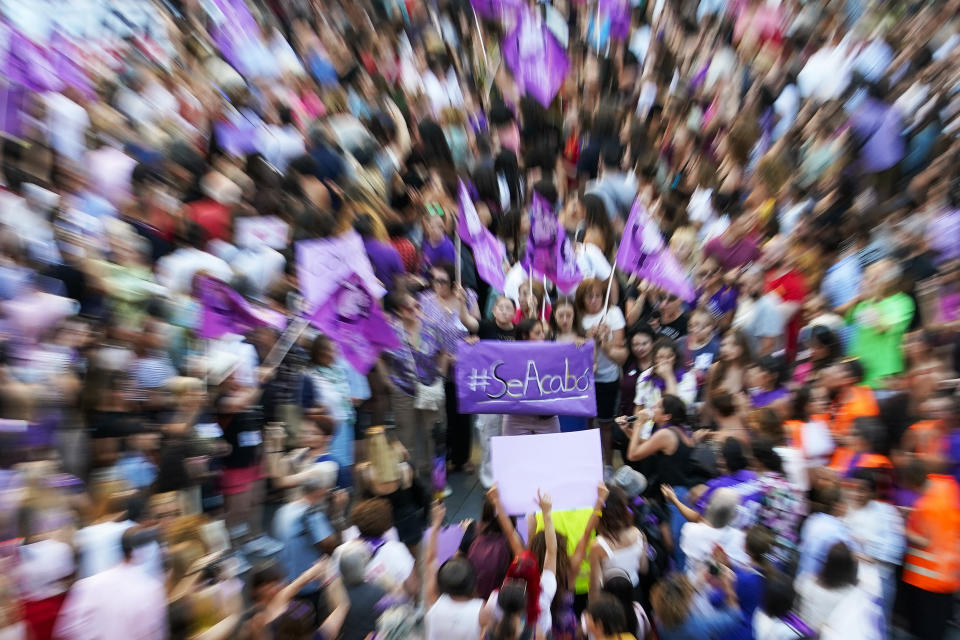 Demonstrators gather during a protest against the President of Spain's soccer federation Luis Rubiales and to support Spain's national women's soccer player Jenni Hermoso in Madrid on Monday, Aug. 28, 2023. Spain faces reckoning over sexism in soccer after federation head kisses player at Women's World Cup. Banner reads in Spanish "it's over". (AP Photo/Andrea Comas)