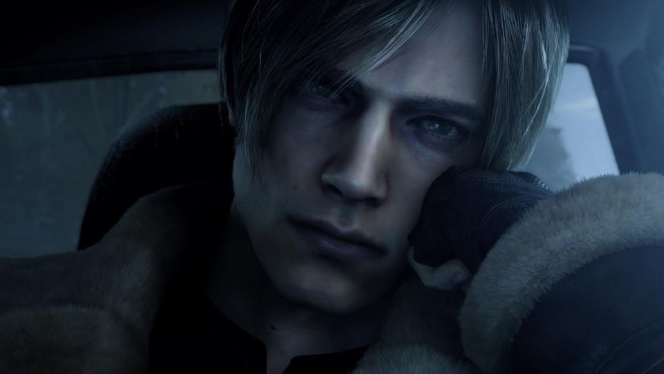 Leon Kennedy rests his head on his hand pensively in Resident Evil 4 remake.