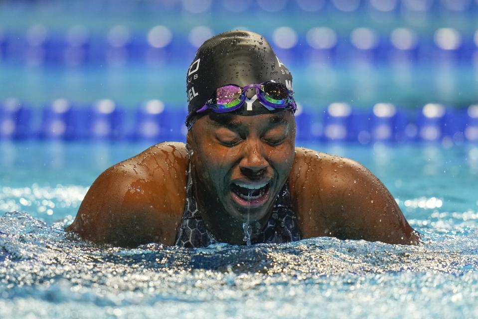 Simone Manuel reacts after winning the women's 50 freestyle during wave 2 of the U.S. Olympic Swim Trials on Sunday, June 20, 2021, in Omaha, Neb. (AP Photo/Jeff Roberson)