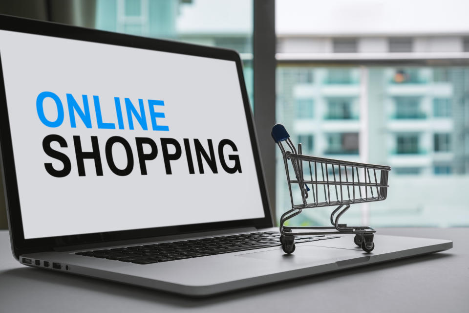 Shopping Cart and Laptop. Online Shopping Concept.