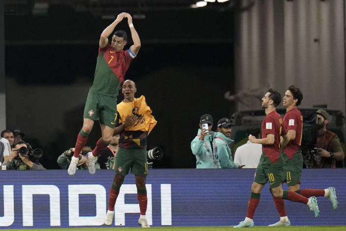 Portugal's Cristiano Ronaldo celebrates after scoring his side's first goal during the World Cup group H soccer match between Portugal and Ghana, at the Stadium 974 in Doha, Qatar, Thursday, Nov. 24, 2022. (AP Photo/Hassan Ammar)