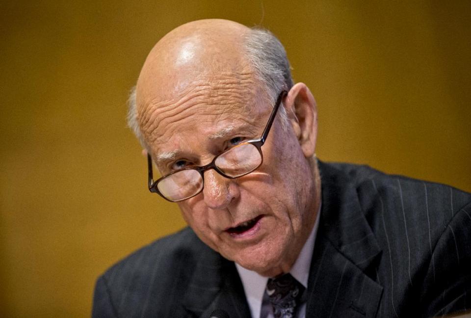 FILE - In this Nov. 6, 2013 file photo, Senate Finance Committee member Sen. Pat Roberts, R-Kansas questions Health and Human Services Secretary Kathleen Sebelius on Capitol Hill, in Washington. Republican senators are attacking GOP challengers earlier and more aggressively than in past elections, including using opposition research to try to knock out upstart rivals before they become serious threats. Milton Wolf, who trying to oust three-term Sen. Roberts is apologizing for posting graphic images of gunshot victims on his Facebook page some years ago. (AP Photo/J. Scott Applewhite, File)