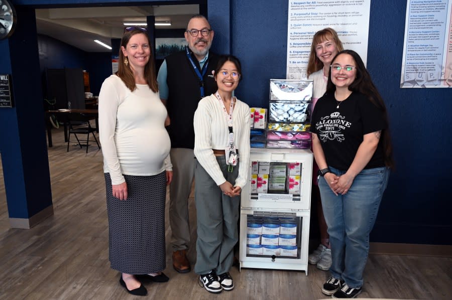 From left to right: Alex Kellogg, Chris Howk, Arnette Lim, Kit Matzke and Elicia Chacon, all of the COVID-19 and Harm Reduction teams from Arapahoe County Public Health, pose with the first Health Supply Kiosk installed in Arapahoe County.