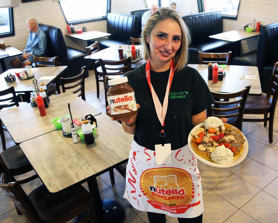 Ledia Duka of Steve's Diner in Exeter shows off the pancakes that recently won the Nutella Fancakes Award. The competition is a fan-voted competition across America. Steve's Diner was one of six independent pancake shop named winners.