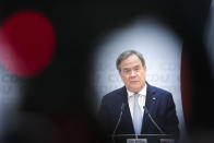 German Christian Democratic Union Party Chairman Armin Laschet briefs the media after a meeting of the party's board at the headquarters in Berlin, Germany, Monday, April 12, 2021. The leadership of Chancellor Angela Merkel's party CDU has backed party chairman Armin Laschet's bid to become the center-right candidate as Germany's next chancellor in the upcoming general elections. (AP Photo/Markus Schreiber, Pool)