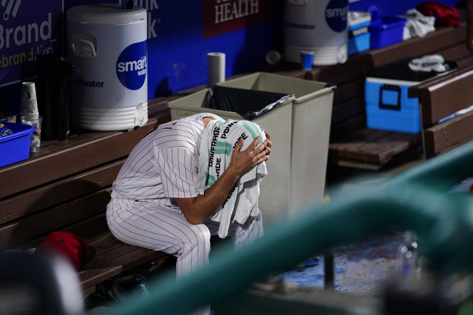 Philadelphia Phillies pitcher Andrew Bellatti sits in the dugout after a baseball game against the San Francisco Giants, Tuesday, May 31, 2022, in Philadelphia. (AP Photo/Matt Slocum)