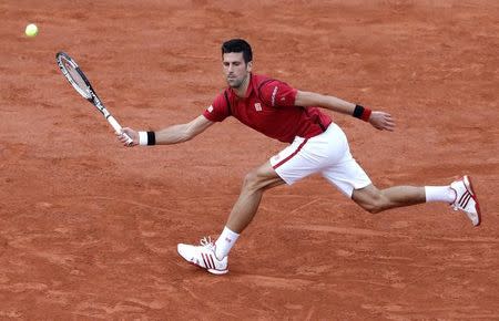 Tennis - French Open - Roland Garros - Novak Djokovic of Serbia v Aljaz Bedene of Britain - Paris, France - 28/05/16. Djokovic returns a shot. REUTERS/Jacky Naegelen