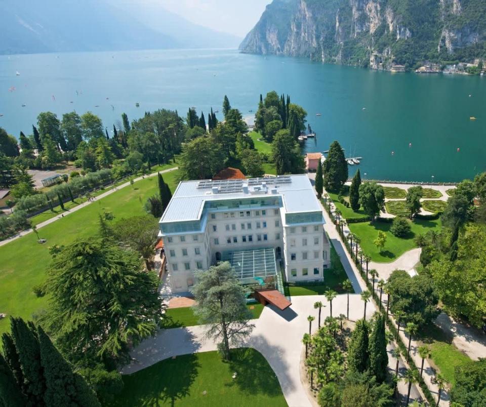 <p>The mountain-backed <a href="https://www.booking.com/hotel/it/lido-palace.en-gb.html?aid=1922306&label=lake-garda-hotels" rel="nofollow noopener" target="_blank" data-ylk="slk:Lido Palace" class="link ">Lido Palace</a> is in an art nouveau building in the town of Riva del Garda. The Grand Tour-worthy getaway has been eased up to date with a glass atrium, abstract artworks, a neon-lit bar and colourful furnishings. As is the norm in most Lake Garda hotels, the famous water is on show through floor-to-ceiling windows. <br> <br>It’s perfectly placed for evening strolls into town – the grounds lead straight onto the lake-edge promenade – and these northern shores are also popular for sports such as sailing, kayaking and windsurfing.</p><p><a class="link " href="https://www.goodhousekeepingholidays.com/offers/lake-garda-riva-del-garda-hotel-lido-palace" rel="nofollow noopener" target="_blank" data-ylk="slk:READ OUR REVIEW">READ OUR REVIEW</a></p><p><a class="link " href="https://www.booking.com/hotel/it/lido-palace.en-gb.html?aid=1922306&label=lake-garda-hotels" rel="nofollow noopener" target="_blank" data-ylk="slk:CHECK AVAILABILITY">CHECK AVAILABILITY</a></p>