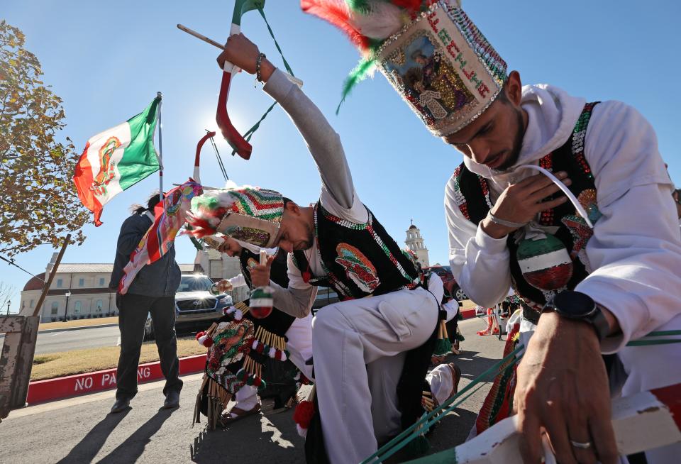 Matachines dancers kneel as the participate in a processional for the feast day of St. Juan Diego as it ends at Tepeyac Hill at the Blessed Stanley Rother Shrine on Saturday in Oklahoma City. Mandatory Credit: Steve Sisney-The Oklahoman
(Credit: Steve Sisney for The Oklahoman)