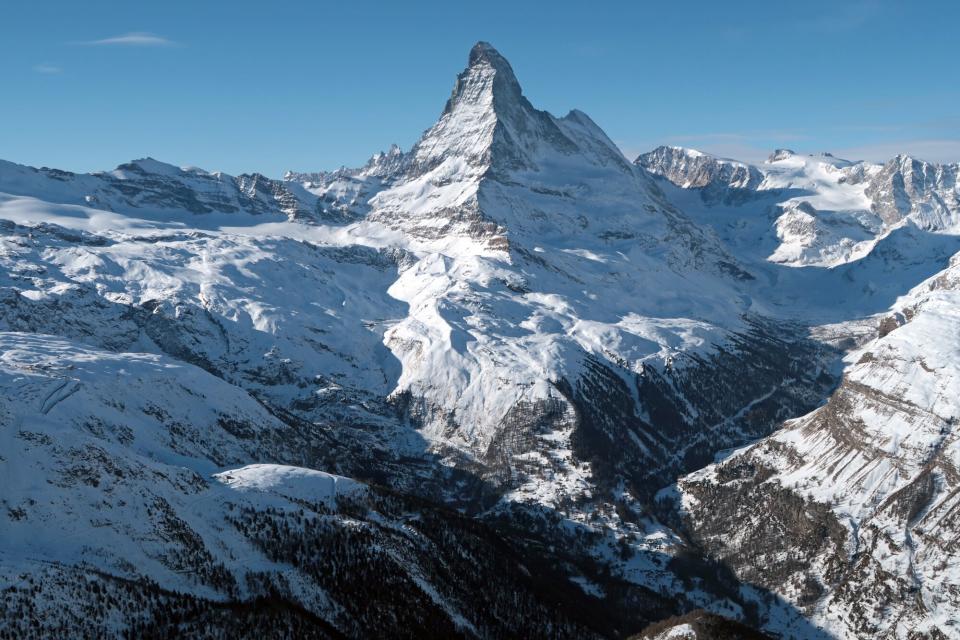 Matterhorn mountain looms above the valley that includes the village of Zermatt on January 7, 2022 near Zermatt, Switzerland. Zermatt is a popular tourist destination both in winter and summer.