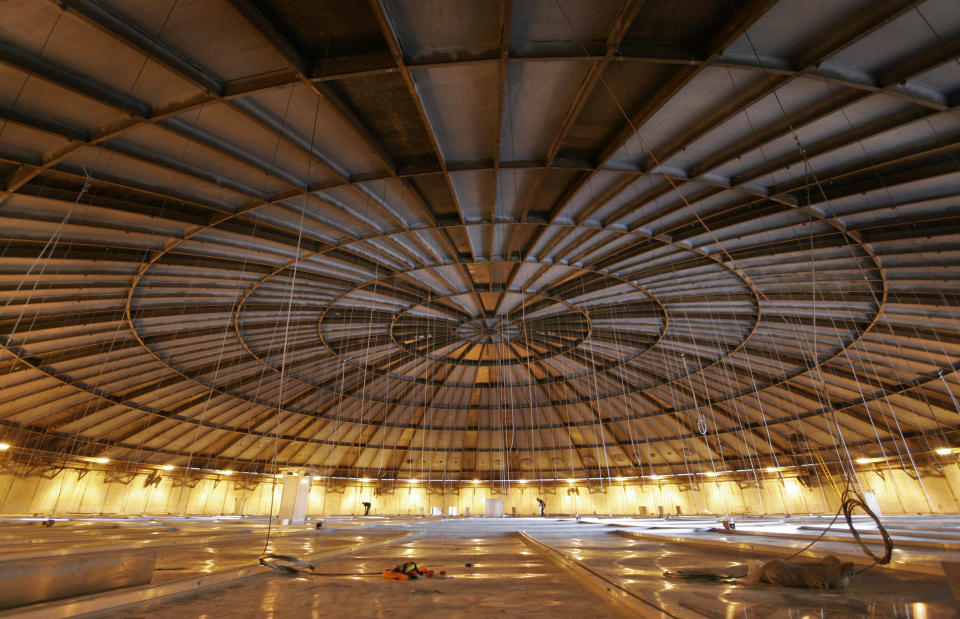 FILE - In this April 4, 2007 file photo, work continues inside a tank at the Sempra liquefied natural gas plant under construction in Hackberry, La. Since Donald Trump took office, America’s exports of liquid natural gas and crude oil have surged, rivaling the likes of Saudi Arabia and Russia. To achieve “energy dominance,” the Trump administration has taken its cues from an unlikely source: the Obama administration. (AP Photo/Alex Brandon)