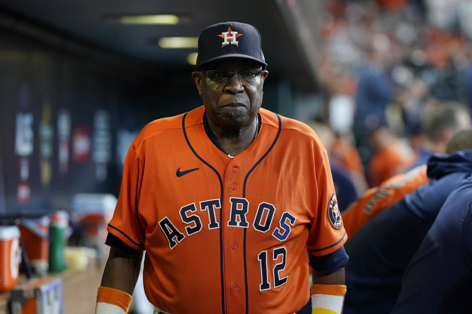 Houston Astros manager Dusty Baker Jr. (12) walks through the dugout during the seventh inning in Game 2 of a baseball American League Division Series against the Chicago White Sox Friday, Oct. 8, 2021, in Houston. (AP Photo/David J. Phillip)