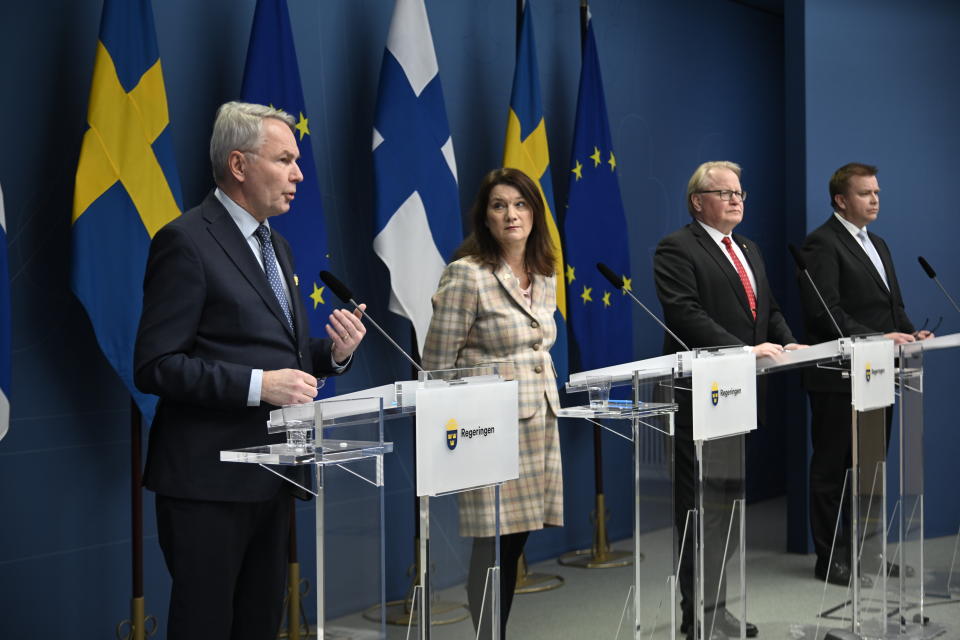 From left, Finland's Minister for Foreign Affairs Pekka Haavisto, his Swedish counterpart Ann Linde, Sweden's Defence Minister Peter Hultqvist, and his Finnish counterpart Antti Kaikkonen hold a joint press conference in Stockholm, Sweden, Wednesday, Feb. 02, 2022, after talks on European security. (Anders Wiklund, TT News Agency via AP)