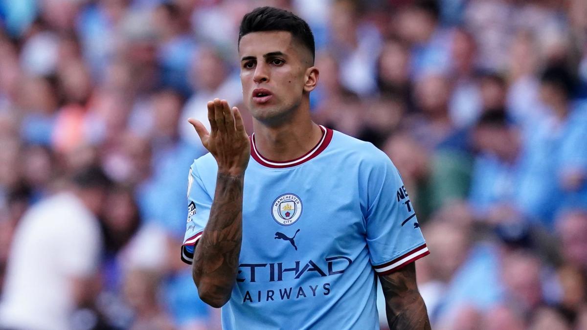 Manchester City's Joao Cancelo heads the ball during the Champions