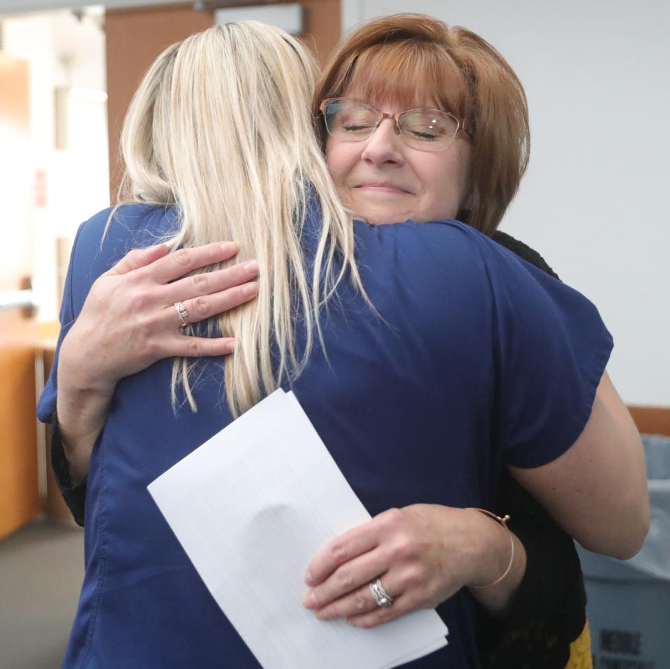 Diane New gets a hug from Cleveland Clinic Akron General nurse Jamie Plazak after her organ donor presentation Friday in Akron. New's son, Ryan Tucholsky, was killed by a drunken driver in 2022 and his organs were donated.