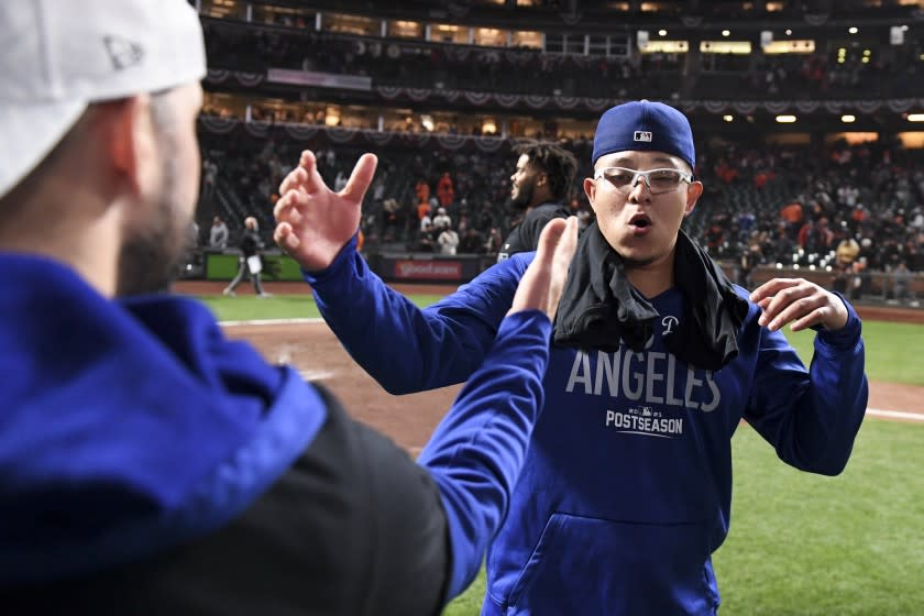 San Francisco, CA - October 14: Los Angeles Dodgers starting pitcher Julio Urias celebrates after game five of the 2021 National League Division Series against the San Francisco Giants at Oracle Park on Thursday, Oct. 14, 2021 in San Francisco, CA. The Dodgers won 2-1. (Wally Skalij / Los Angeles Times)