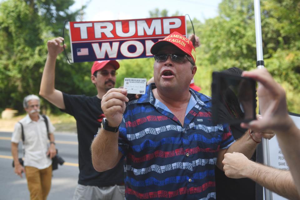 Aug 24, 2023; Atlanta, GA, USA; Trump supporters at Fulton County Jail intake center in Atlanta, GA. A grand jury in Fulton County, Georgia indicted former president Donald Trump and 18 other defendants with 41 charges related to tampering with the 2020 election. All defendants have been ordered to turn themselves in by August 25.. Mandatory Credit: Katie Goodale-USA TODAY