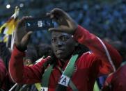 2016 Rio Olympics - Closing ceremony - Maracana - Rio de Janeiro, Brazil - 21/08/2016. Athletes take pictures as they take part in the closing ceremony. REUTERS/Stefan Wermuth