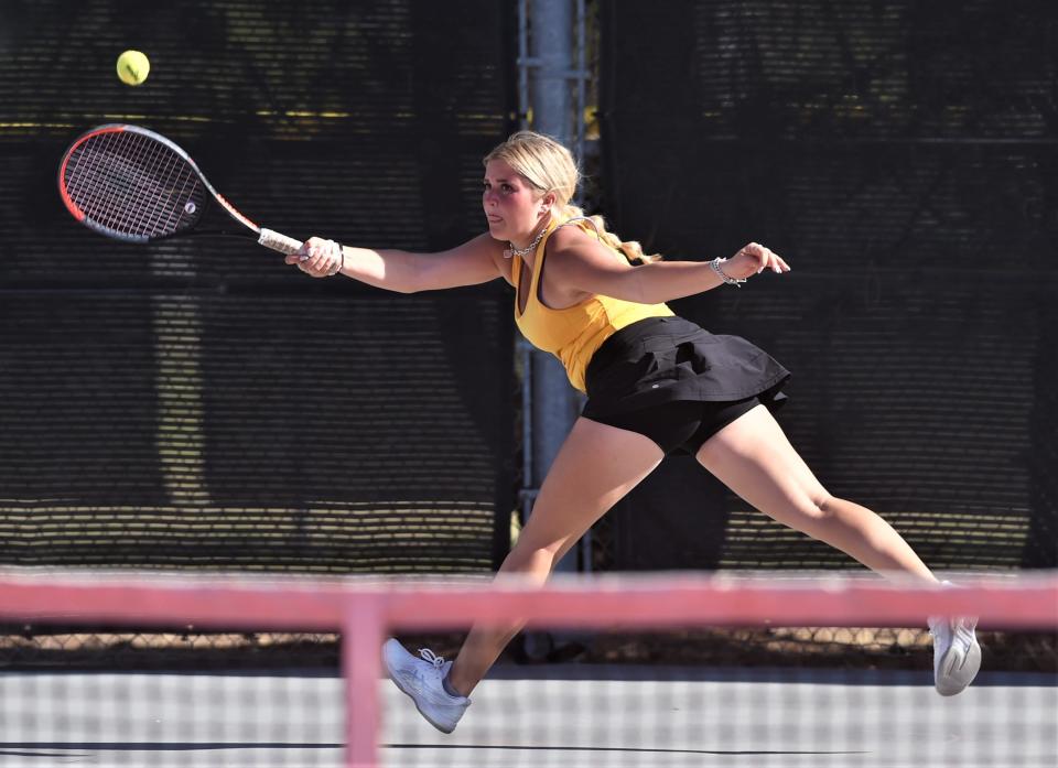 Wylie's Suhejla Qinami runs down a shot against Wichita Falls Rider's Kotomi Nishihara and Eleny Sandoval-Almuna. The Rider team beat Qinami and Kindall Alford 6-2, 3-6, 7-6 (4) in the second round at the Region I-5A tournament Monday, April 10, 2023, at the McLeod Tennis Center in Lubbock.