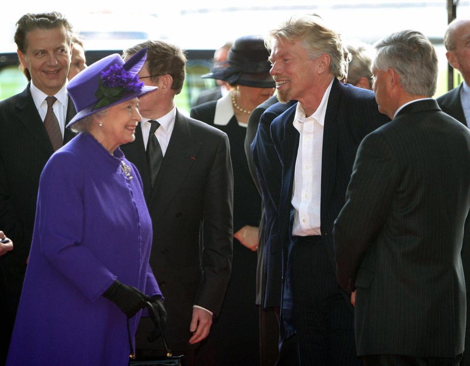 Queen Elizabeth II greets Sir Richard Branson at the Airbus factory in Toulouse, France, on the final day of her state visit France 07 April, 2004.