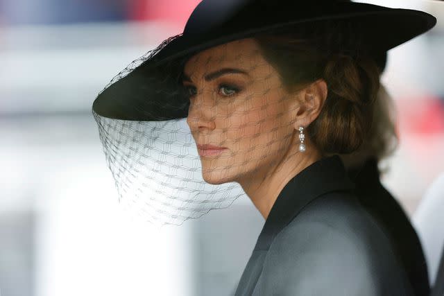 <p>Tom Jenkins - WPA Pool/Getty</p> Kate Middleton, Princess of Wales is driven down The Mall after the funeral for HM Queen Elizabeth II's funeral on September 19, 2022 in London, England.