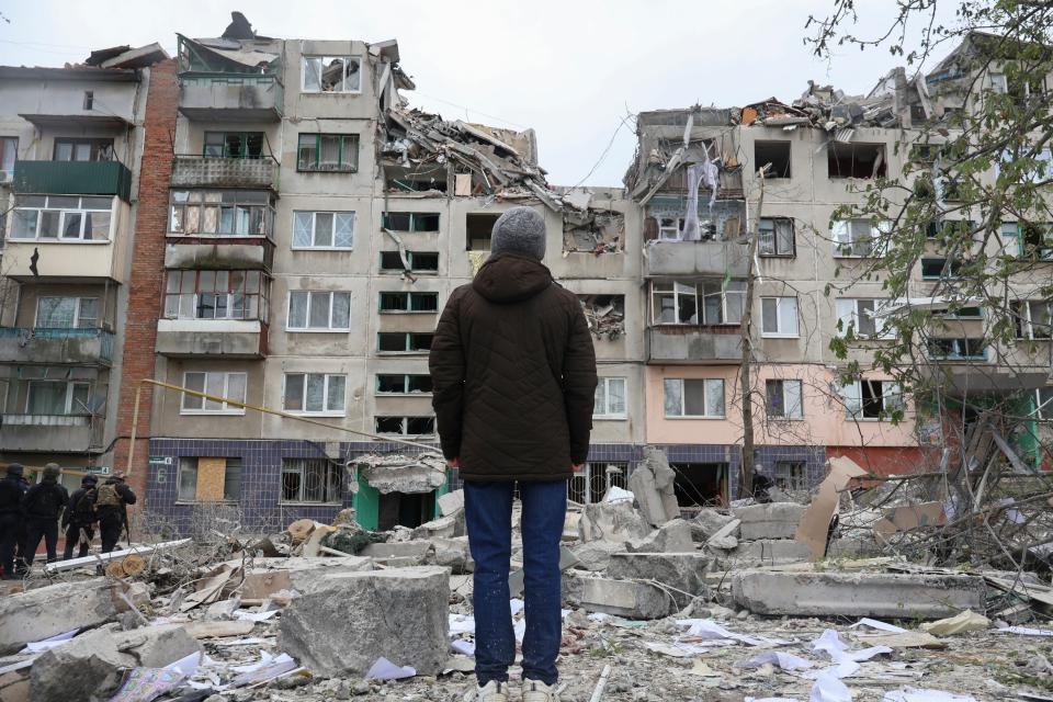 A local resident looks at his home, damaged in today Russian rocket attack in Sloviansk, Donetsk region, Ukraine, Friday (AP)