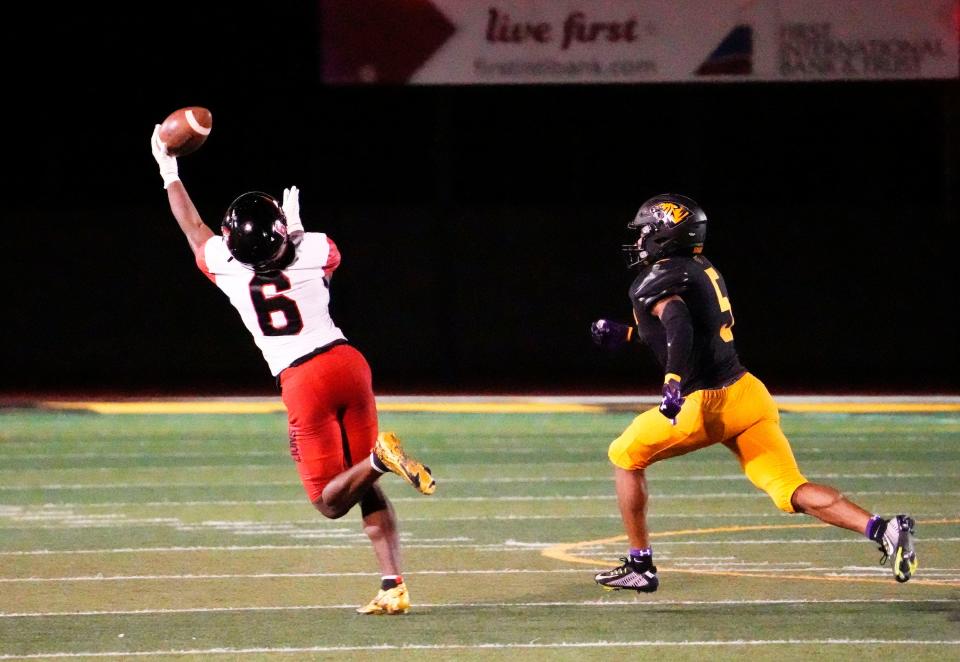 Sep 30, 2022; Scottsdale, AZ, USA; Liberty Lions wide receiver Prince Zombo (6) makes a one-handed catch past Saguaro Sabercats defensive back Cole Shivers (5) during a game played at Saguaro High.