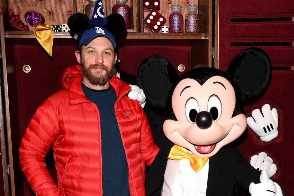 Double take: Tom Hardy donned Mickey Mouse ears for the photo (Rex)