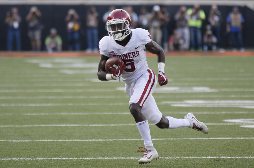 Oklahoma wide receiver Marquise Brown carries during an NCAA college football game between Oklahoma and Oklahoma State in Stillwater, Okla., Saturday, Nov. 4, 2017. (AP Photo/Sue Ogrocki)