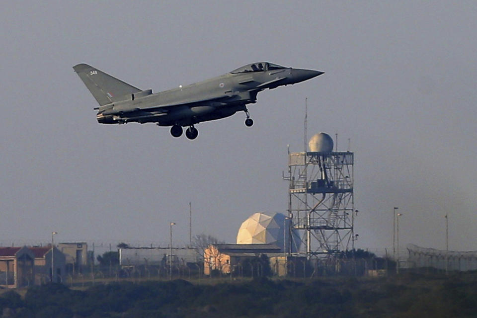 <p>A Typhoon aircraft prepares for landing at the British Royal Air Force base in Akrotiri, near costal city of Limassol in the eastern Mediterranean island of Cyprus, early Saturday, April 14, 2018. (Photo: Petros Karadjias/AP) </p>