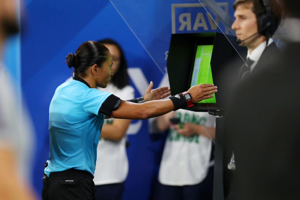 Referee Edina Alves Batista checks the VAR monitor during the Women's World Cup France semi-final. (Photo by Catherine Ivill - FIFA/FIFA via Getty Images)