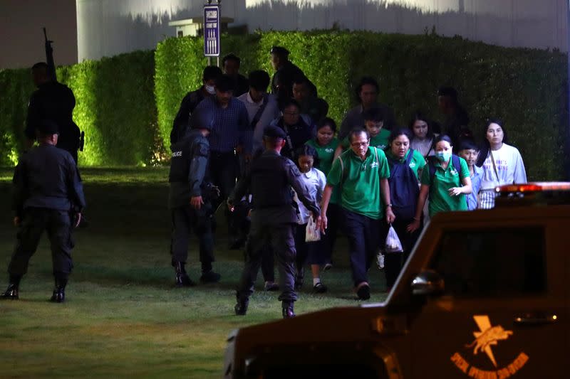 Thailand security forces evacuated people from a shopping mall as they chase a shooter hidden in after a mass shooting in front of the Terminal 21, in Nakhon Ratchasima, Thailand