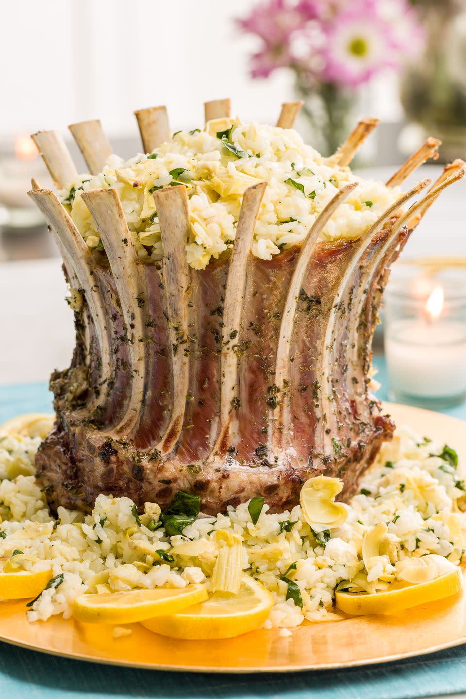 <p>If you want a total stunner this Easter, you need to make this crown roast of lamb. Stuffed with cheesy spinach-artichoke rice, this lamb main dish will definitely impress your guests.</p><p>Get the Spinach-and-Artichoke Crown Roast of Lamb recipe <strong><a href="https://www.delish.com/cooking/recipe-ideas/recipes/a46462/spinach-and-artichoke-crown-of-lamb-recipe/" rel="nofollow noopener" target="_blank" data-ylk="slk:from Delish;elm:context_link;itc:0;sec:content-canvas" class="link ">from Delish</a></strong>.</p>